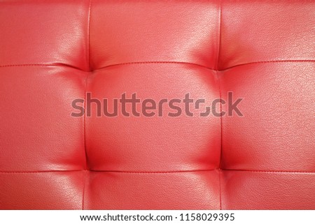 Red leather sofa texture background