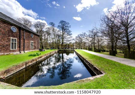 Stunning landscape of Dunham Massey, old historical stately home near Manchester, the National Trust, national parks, NT Royalty-Free Stock Photo #1158047920