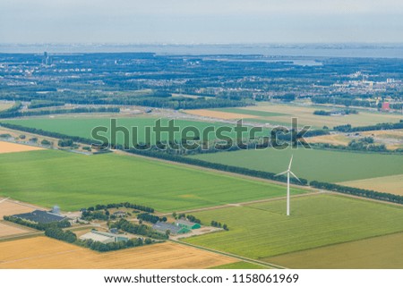 Aerial photography of Dutch agriculture fields and wind turbines