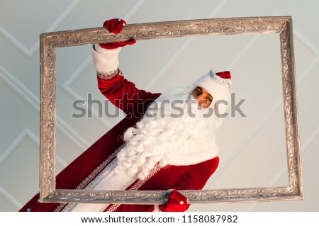 Santa Claus and Snow Maiden are waiting for Christmas,
Saint Nicholas and the assistant in the frame
