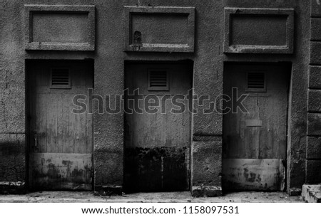 A picture of three old doors.