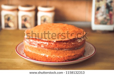 Orange homemade cake prepared for icing and fondant