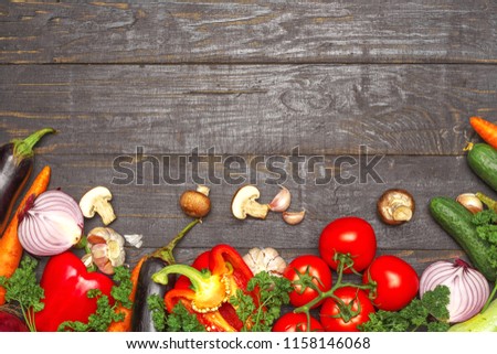 Healthy eating background. Food photography different vegetables on dark wood background. Copy space.