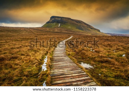 Pen-Y-Ghent
The hills of Whernside (736 m or 2,415 ft), Ingleborough (723 m or 2,372 ft) and Pen-y-ghent (694 m or 2,277 ft) are collectively known as the Three Peaks. Royalty-Free Stock Photo #1158223378