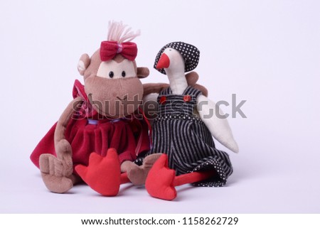 Scene with two children"s  toys shot on a white background.