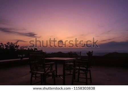 The chairs with table among the beautiful scenery of the twilight sky of northern of Thailand.