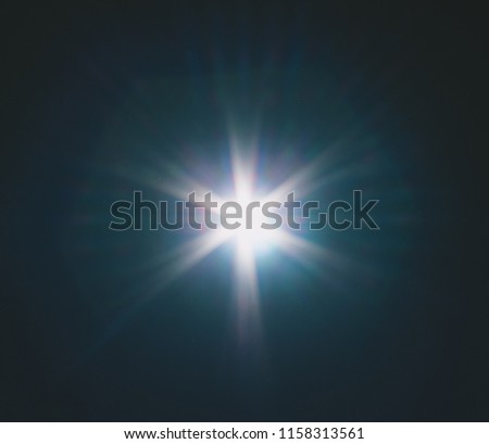 A greenish blue shaded lens flare overlay effect/bokeh inspired texture. 