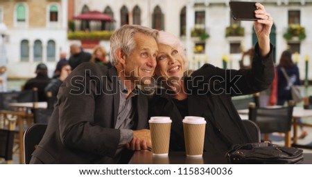 Mature couple taking a selfie in Venice
