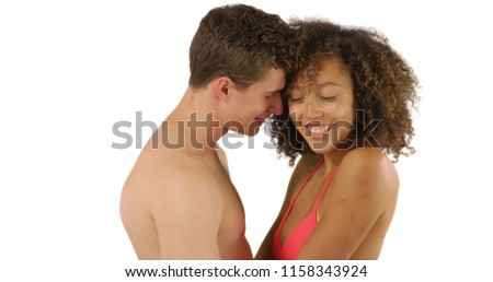 Portrait of African girl in swimwear enjoying her boyfriend in studio