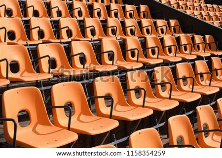 Empty rows of seats at football and sports stadium