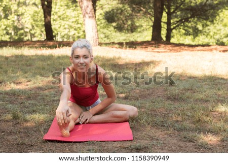 Calm lady is sitting in the open air	
