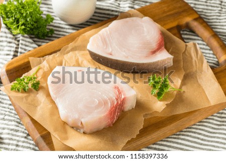 Raw Organic Swordfish Steak Filets Ready to Cook Royalty-Free Stock Photo #1158397336