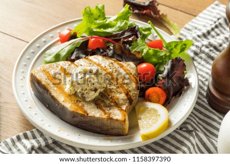 Organic Grilled Swordfish Steak with a Side Salad Royalty-Free Stock Photo #1158397390
