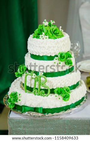 Sweet cake with cream and letters O and B