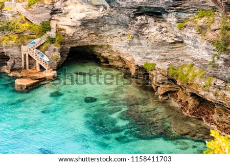 Paradise travel destination beach in Hamilton, Bermuda.
Deep Bay Beach with golden sand and a beautiful rock formation. Royalty-Free Stock Photo #1158411703