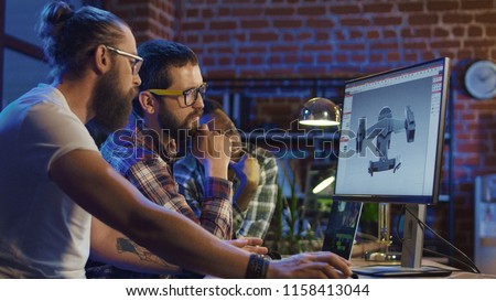 Two men create video game and developing graphics for movie Royalty-Free Stock Photo #1158413044
