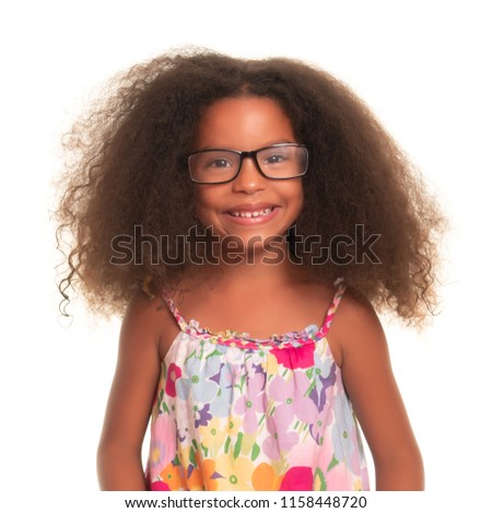 Smiling African American girl wearing glasses on an isolated white background