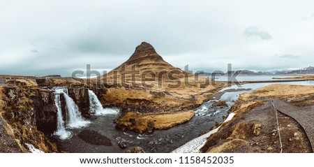 Kirkjufell mountain and waterfall in Ieland. panoramic merge photo