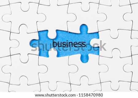 white puzzle with business word. business and teamwork concept