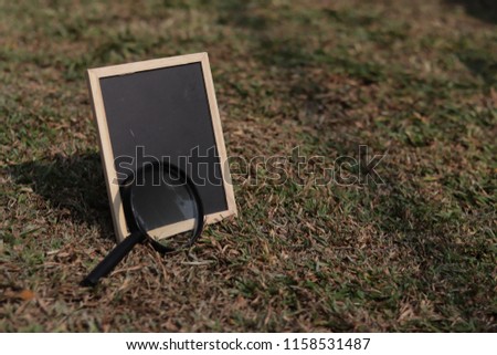 chalk board and magnifying glass for science experiment educcation