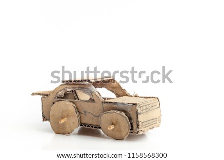 Cardboard or corrugated box car toys on white background. children handcraft