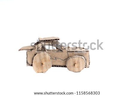 Cardboard or corrugated box car toys on white background. children handcraft