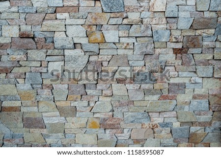 Different colors stone tiles wall texture background