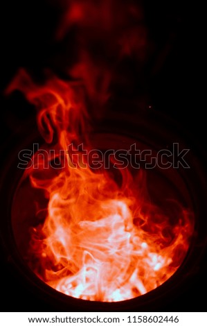 Orange sparks of fire, background  isolated on black. 