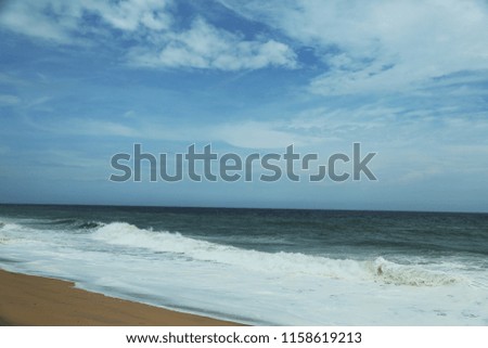 Beautiful sandy beach with blue sky and tropical sea