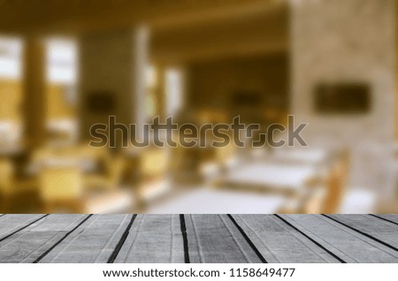 Wood table top and Blur restaurant - vintage effect style picture. can be use for display or montage your products.