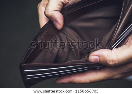 Wallet empty money broke cash ,bankruptcy economic financial , Poverty in retirement and unemployment concept. Royalty-Free Stock Photo #1158656905