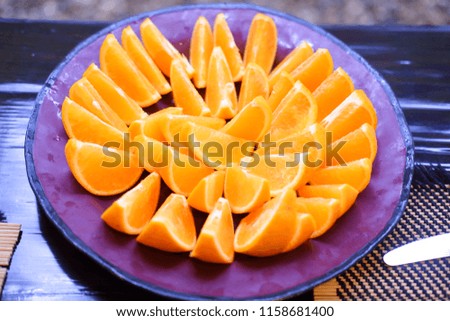 fresh orange slice in vintage plate