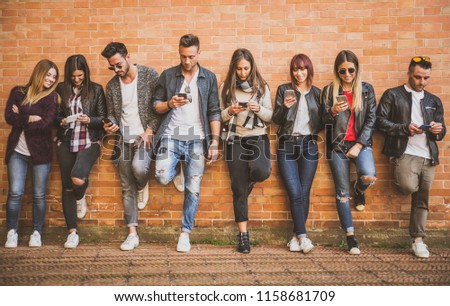 Group of teenagers with smartphone outdoor