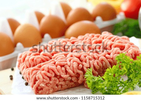 Fresh raw minced meat with spices ready to be cooked