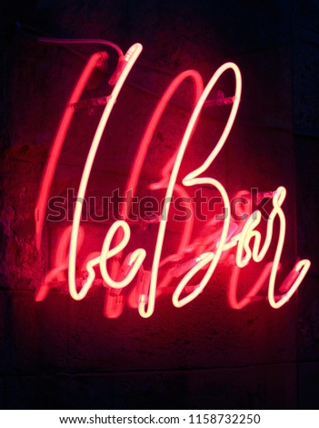 neon inscription, beautiful inscription on the wall. Excellent red light, good background
