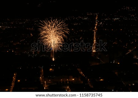 Fireworks over the city of Grenoble during the 14th of July to celebrate the Bastille Day (national day of France)