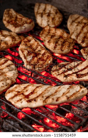 Grilled beef steak on the grill, close-up.