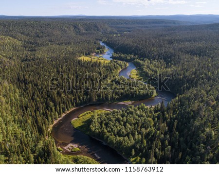 Aerial view of vast boreal aka taiga forest on sunny summer day in Oulanka National Park, Finland Royalty-Free Stock Photo #1158763912