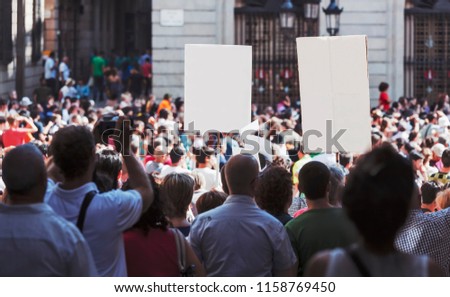 Protesting demonstration holding signs in Barcelona Royalty-Free Stock Photo #1158769450