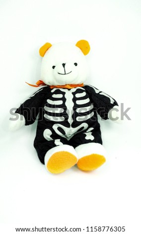 White teddy bear, Halloween skeleton on white background isolated.
