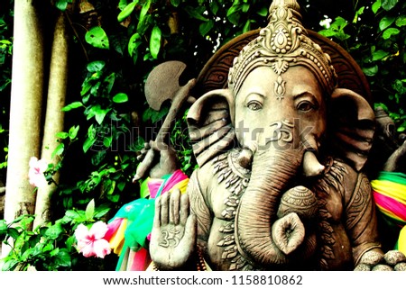 Ganesha under the tree.