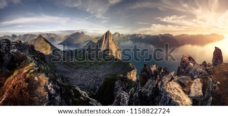 Mountainous panorma landscape view with huge fjords during golden sunset in Senja, Norway Royalty-Free Stock Photo #1158822724