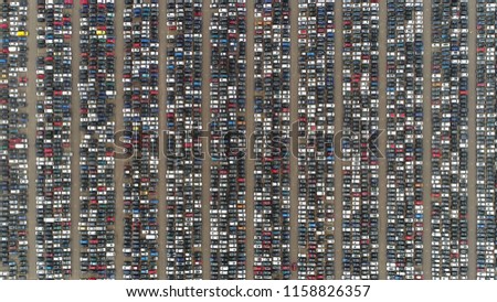Aerial top down photo automaker car lot showing vehicles parked close to each other ready for further distribution the automotive industry is one of worlds most important economic sectors by revenue Royalty-Free Stock Photo #1158826357