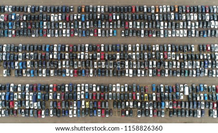 Aerial top down picture of automaker car lot showing vehicles parked close to each other ready for further distribution Royalty-Free Stock Photo #1158826360