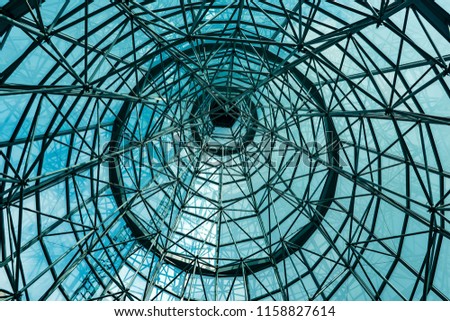 Perspective View of Shiny Metal Structure of Roof with Blue Glasses Windows for Modern Interior used as Background Texture
