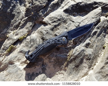 knife in the background stones