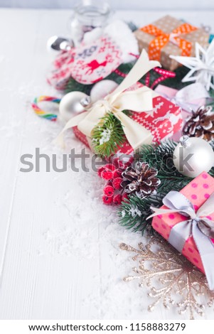 Christmas background with decorations and gift boxes on wooden board with copy space