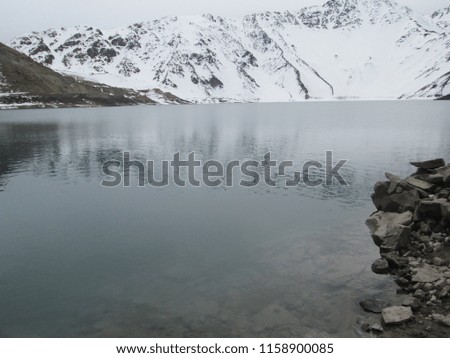the El Yeso reservoir as a reflection of the snow mountain in Santiago de Chile