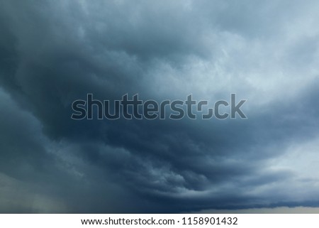 Perspective view of dramatic grey rainy sky with white grey clouds. Rain sky clouds. High resolution artistic skyline background image