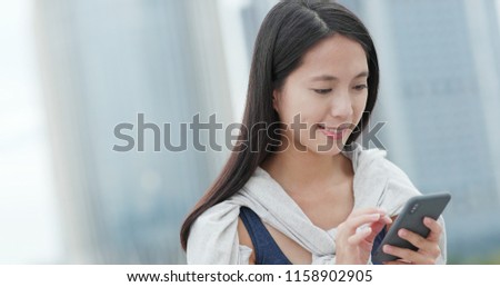 Woman work on smart phone at outdoor